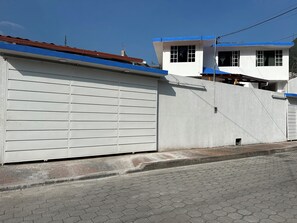 Stylish two-story residence with a garage door and living space above.