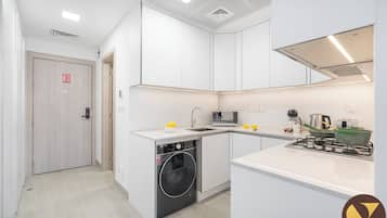 Luxury Studio | Private kitchen | Full-size fridge, microwave, oven, electric kettle