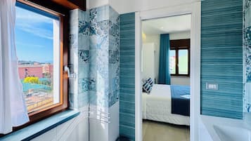 Superior Double Room, City View | Bathroom | Shower, hair dryer, towels, soap