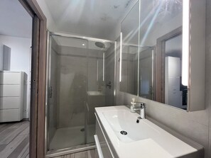 Shower, hair dryer, towels, soap