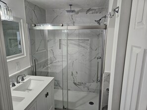 Shower, towels, soap, toilet paper