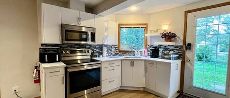 Fridge, microwave, stovetop, coffee/tea maker