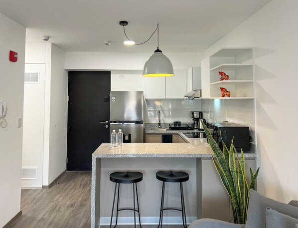 Apartment (705) | Private kitchen | Microwave, toaster, blender, cookware/dishes/utensils