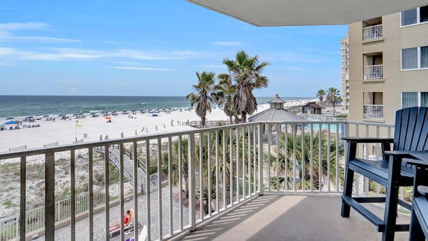 A balcony with a view of a beach and ocean. - Four Winds 304 (Orange Beach)