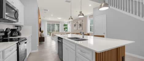 Coffee/tea maker, fridge, microwave, oven