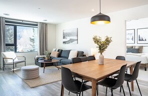 Premium Condo, Balcony, Mountain View | Living area | Flat-screen TV - The Peaks and Birdies (Revelstoke)