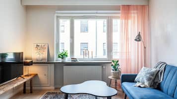 Comfort Apartment, City View | Living area | 46-inch Smart TV with cable channels