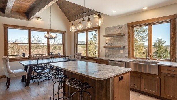 A modern kitchen with a large island, wooden cabinets, and a stone backsplash. - Bethel Escape:Sleeps 10,Hot Tub,GameRoom,Fire Pit (Bethel)