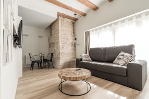 Deluxe Apartment, City View | Living area | Flat-screen TV