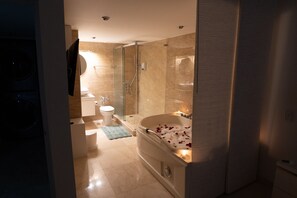 Shower, jetted tub, towels, soap