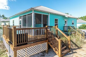 Enjoy the view from the spacious deck with a large sliding glass door and a small window above.