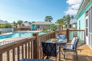 Relax by the pool surrounded by lush greenery and a tranquil seating area.