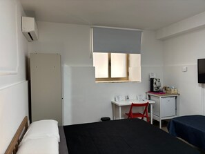 Quarto | Frigobar, cortinas blackout, ferros/tábuas de passar roupa