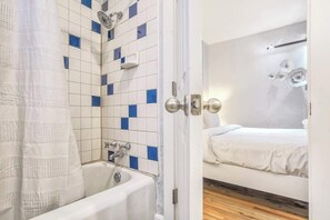 Deluxe Apartment | Bathroom | Combined shower/tub, hair dryer, towels - The San Ayre Court (Colorado Springs)