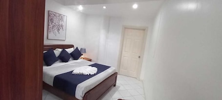 Deluxe Studio, Garden View | In-room safe, blackout drapes, iron/ironing board, free wired internet