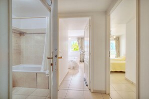 Shower, hair dryer, towels, toilet paper