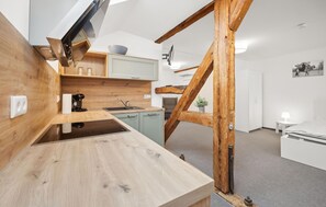 Fridge, stovetop, dishwasher, coffee/tea maker