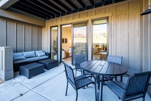 An outdoor patio with a round table, chairs, and a sofa. - Snowbasin Vista Pt C106 | Ski Retreat | Mtn Views (Eden)