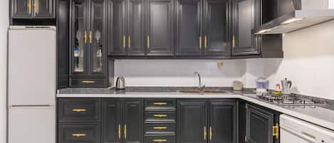 Fridge, microwave, stovetop, coffee/tea maker