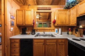 Private kitchen - Avery's Love: Cozy, Couple's Cabin: New Hot Tub, Free WiFi, Dogs OK, Deck Swing (Sevierville)