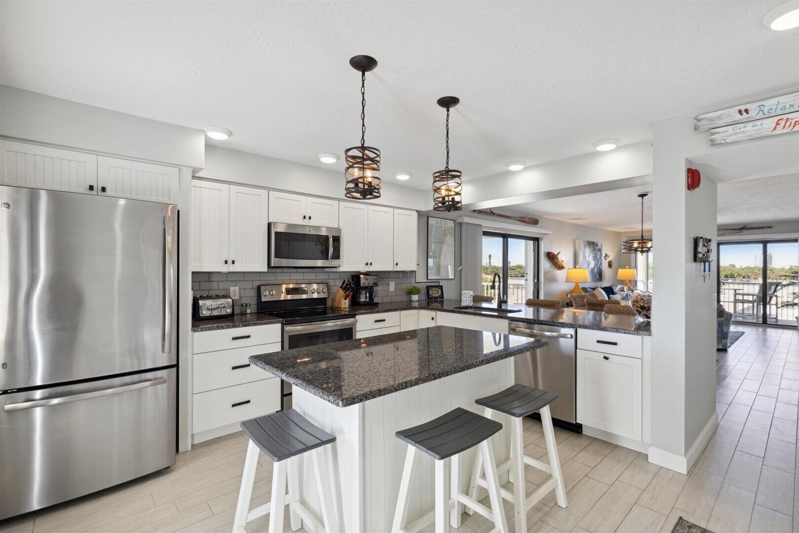 Feel at home to this kitchen with counter island and bar stool chair