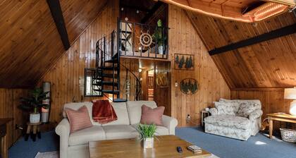 adorable A-frame house nestled right by the river