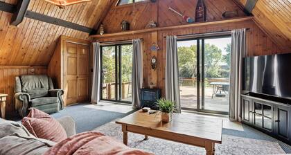 adorable A-frame house nestled right by the river