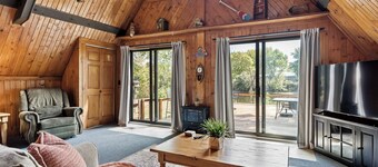 adorable A-frame house nestled right by the river