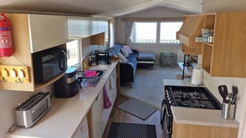 Coffee/tea maker, fridge, microwave, oven