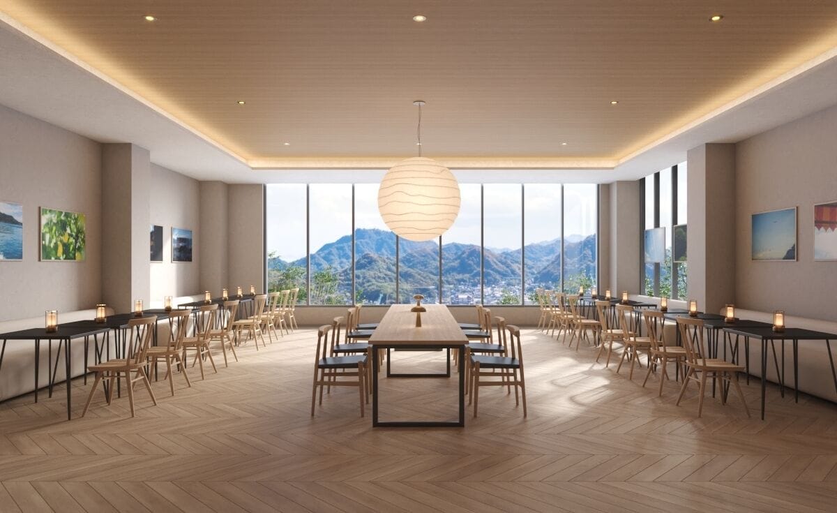 A spacious conference room with a large table and chairs, large windows with a mountain view, and a modern ceiling design.