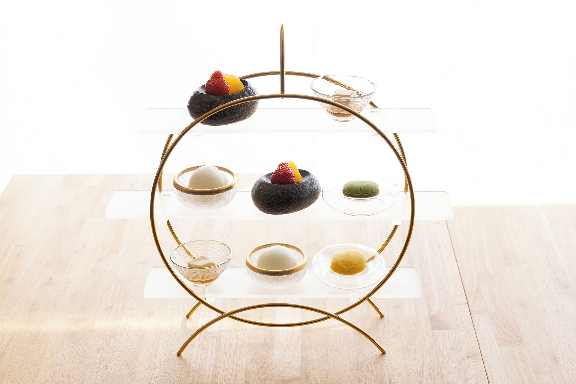 A dessert display stand with various sweets and desserts.