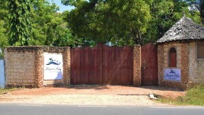 A gated property with a sign reading "Raquels Bliss."