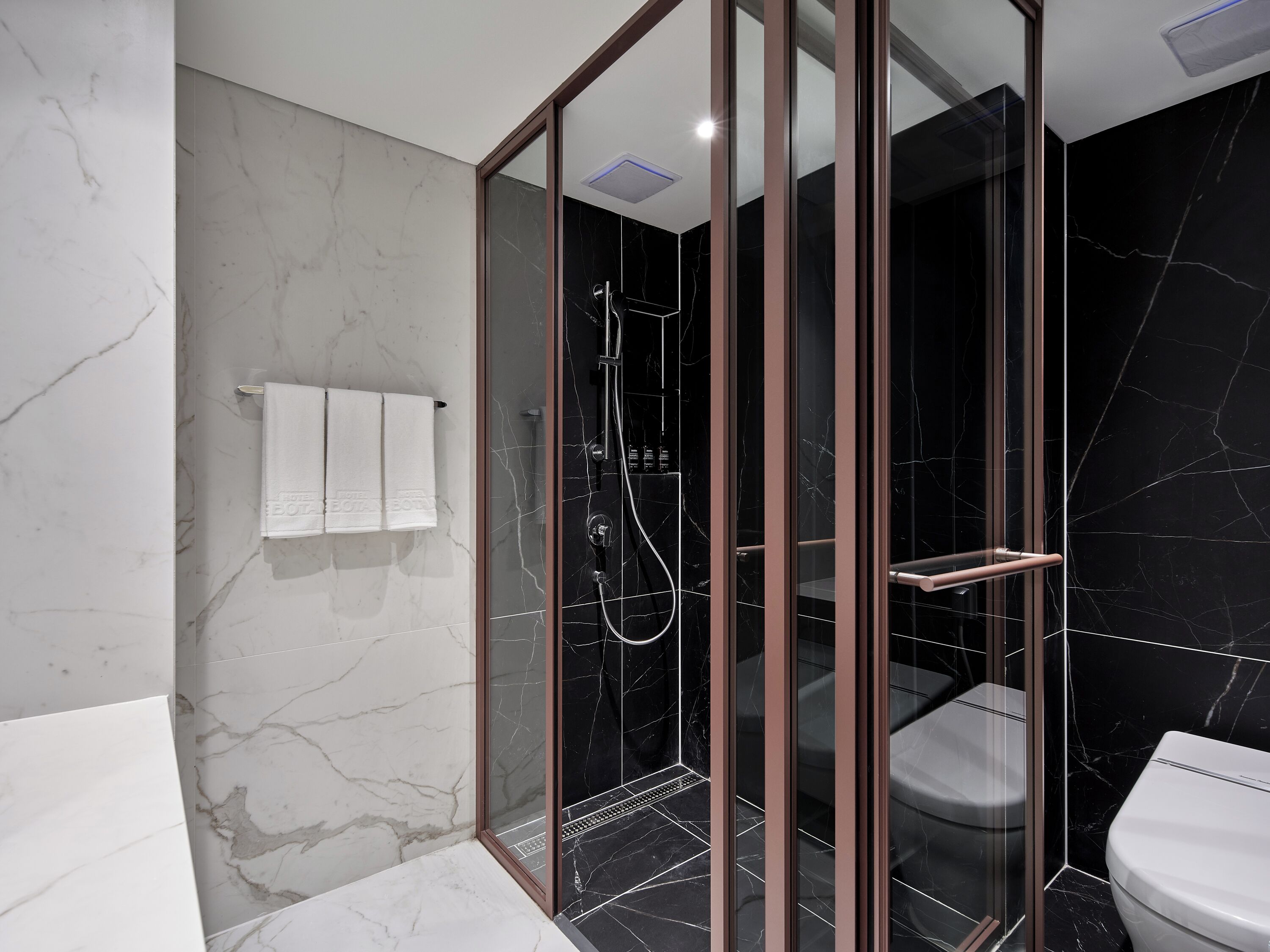 Shower, hair dryer, slippers, towels