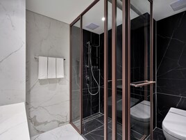 Shower, hair dryer, slippers, towels