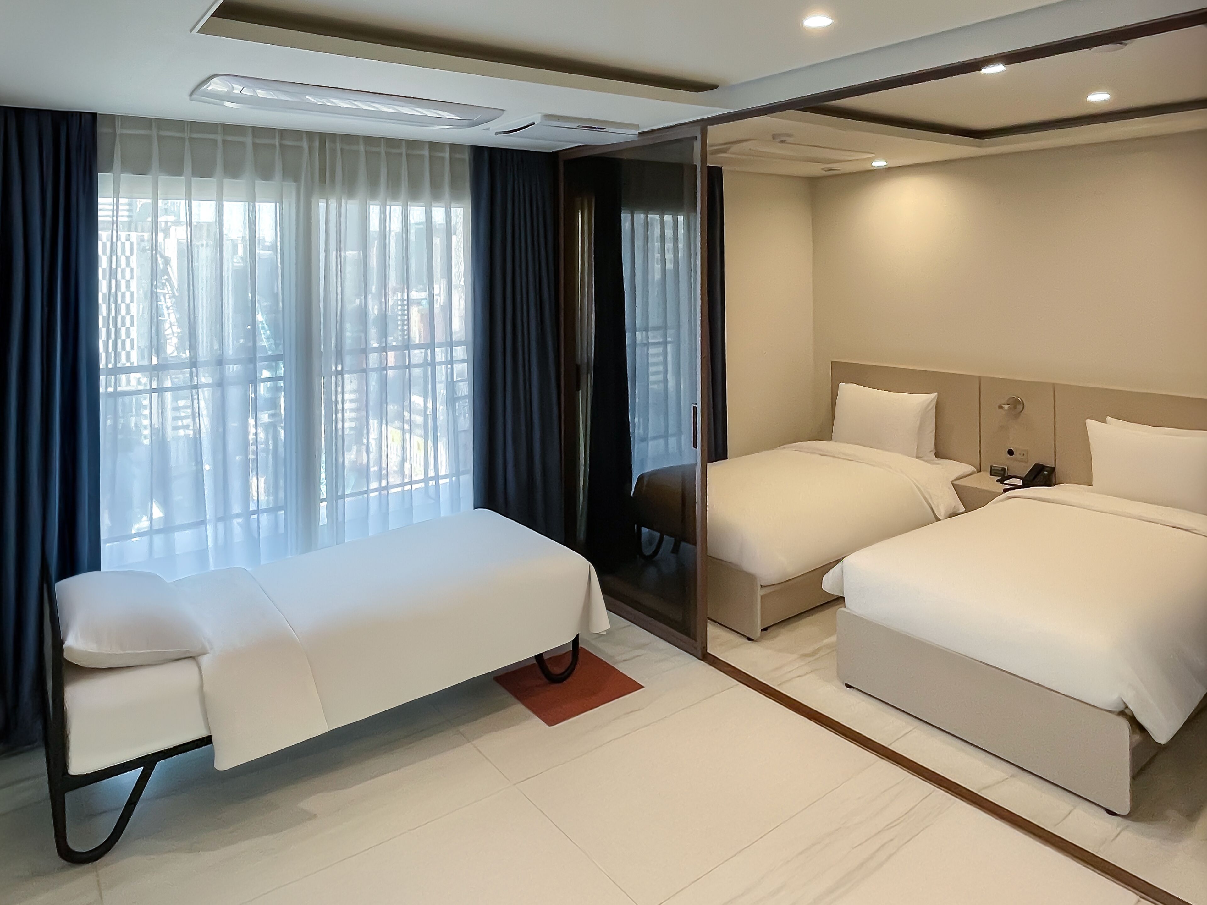 Premier Suite Triple | Down duvets, in-room safe, desk, blackout curtains