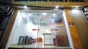 A storefront with a sign reading "HANOISHINING HOUSE & TRAVEL". - Hanoi Shining House (Hanoi)