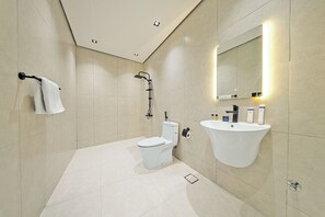 Economy Studio | Bathroom | Slippers, towels, soap, shampoo