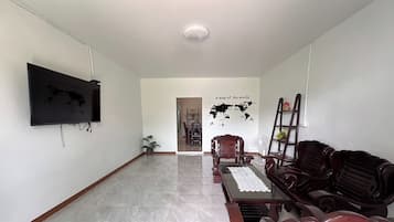 3 Bedrooms House | Living area | 32-inch Smart TV with satellite channels