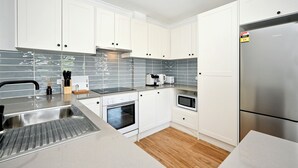 Coffee/tea maker, fridge, microwave, oven