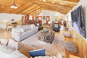 TV, fireplace, table football, ping pong - Angels View Chalet: Spectacular 6 Bedroom Luxury Cabin w/ Incredible Amenities! PET FRIENDLY! HOT TUB! EV Charger! Amazing Game Room w/ Pool Table! Foosball Table! Peaceful Mountain Setting & Sprawling Open Floor Plan! (Big Bear City)