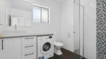 Shower, hair dryer, towels, soap