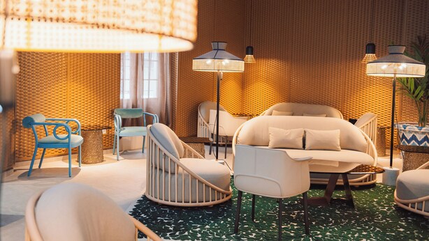 A modern living room with a sofa, chairs, and floor lamps.