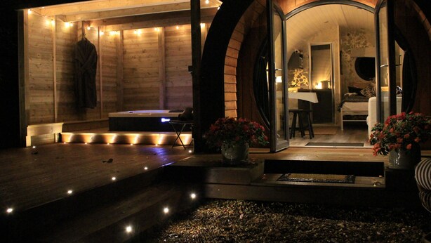 A modern wooden cabin with a sauna, a dining area, and a cozy living space. - Hideaway Cottages - Greenacres Estates (Tenby)
