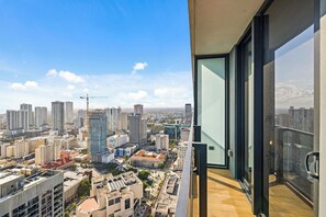 A high-rise building with a view of a cityscape.
