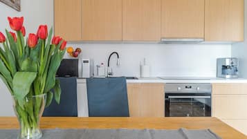 Comfort Apartment, Balcony, River View | Private kitchen | Fridge, microwave, stovetop, dishwasher