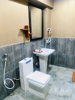 Deluxe Triple Room, Balcony, Garden View | Desk, laptop workspace, soundproofing, free WiFi