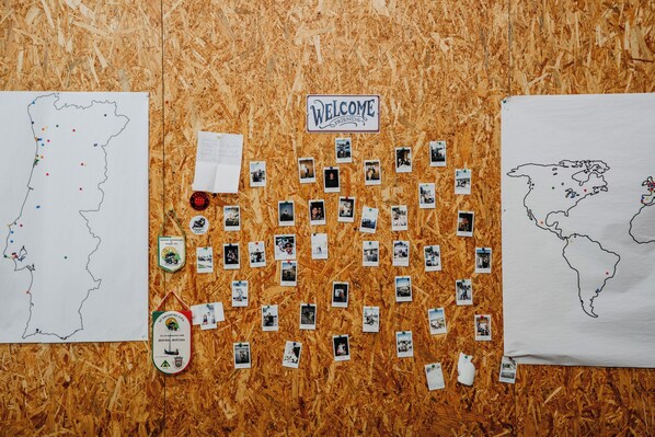 A bulletin board with a map, photos, and a welcome sign. - Welcome Douro (Cinfães)