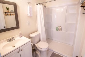 Shower, hair dryer, towels, toilet paper