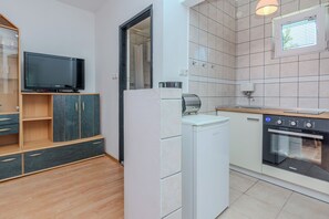 Comfort Apartment, Partial Sea View | Private kitchen | Full-size fridge, microwave, oven, stovetop