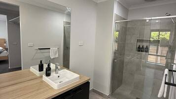 Shower, hair dryer, towels, shampoo